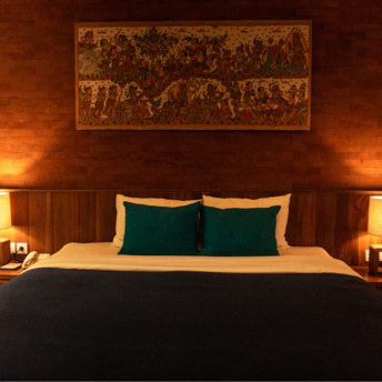 Cozy hotel room with warm lighting and decorative wall art