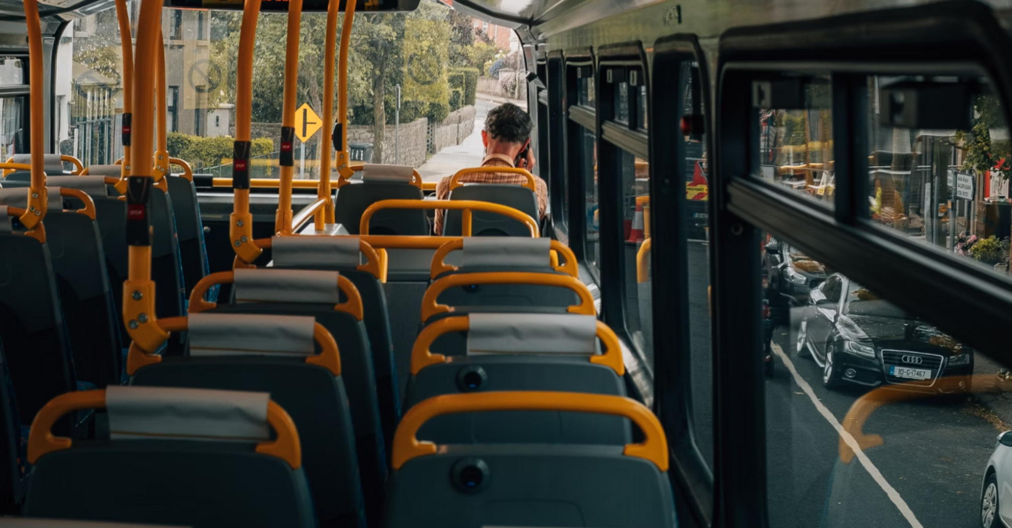 View from inside a nearly empty bus during daytime