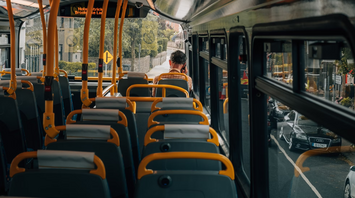 View from inside a nearly empty bus during daytime