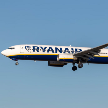 Ryanair Boeing 737 aircraft in flight against clear blue sky