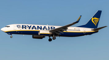 Ryanair Boeing 737 aircraft in flight against clear blue sky