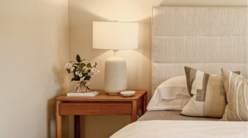 Cozy hotel bedroom with modern decor and soft lighting
