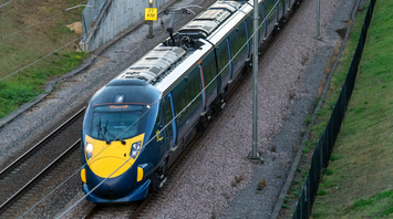 Electric passenger train travelling on mainline track