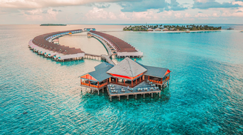 Overwater villas and main building in Baa Atoll, Maldives