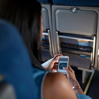 Passenger using smartphone during a flight