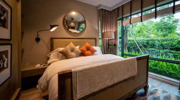 Interior of a Kimpton Ubud guest room with garden view