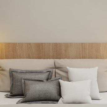 Modern hotel bedroom with neutral tones and ambient lighting