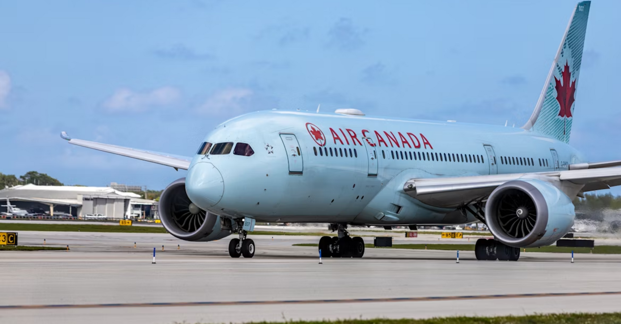 Air Canada aircraft taxiing at the airport