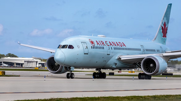 Air Canada aircraft taxiing at the airport