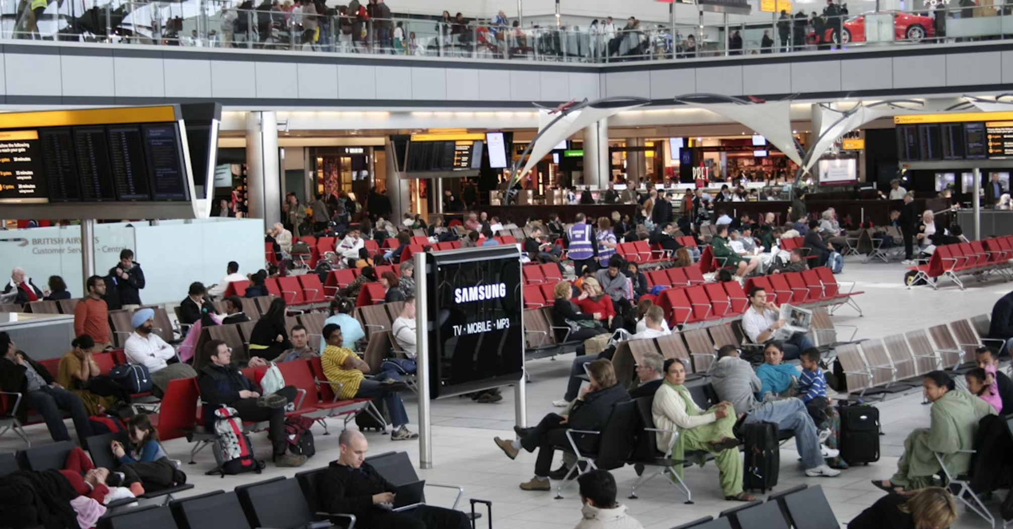 Passengers seated in Terminal 5 at London Heathrow Airport