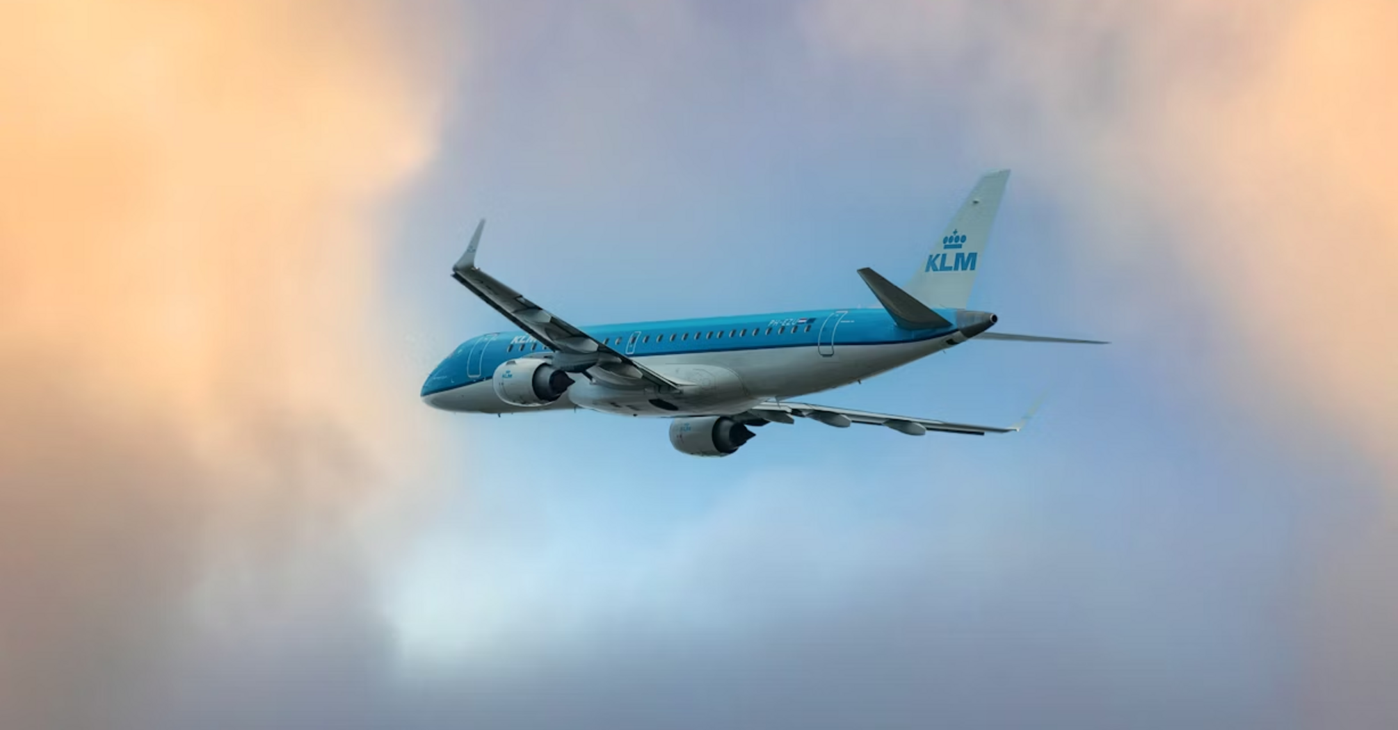 KLM aircraft flying through a colorful sky