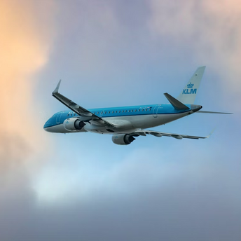 KLM aircraft flying through a colorful sky