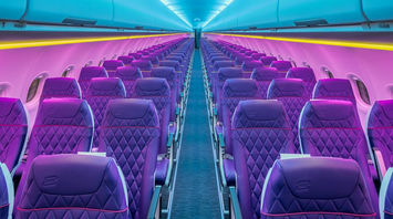Empty airplane cabin with purple seats and mood lighting