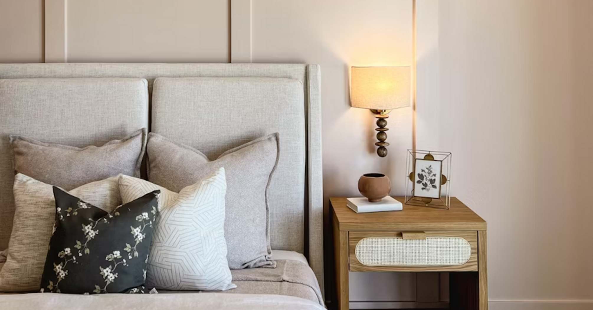 Modern hotel room with stylish neutral decor and soft lighting