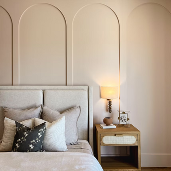 Modern hotel room with stylish neutral decor and soft lighting