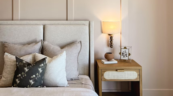 Modern hotel room with stylish neutral decor and soft lighting