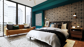 Modern hotel room with geometric wall design, city view, and colorful accents