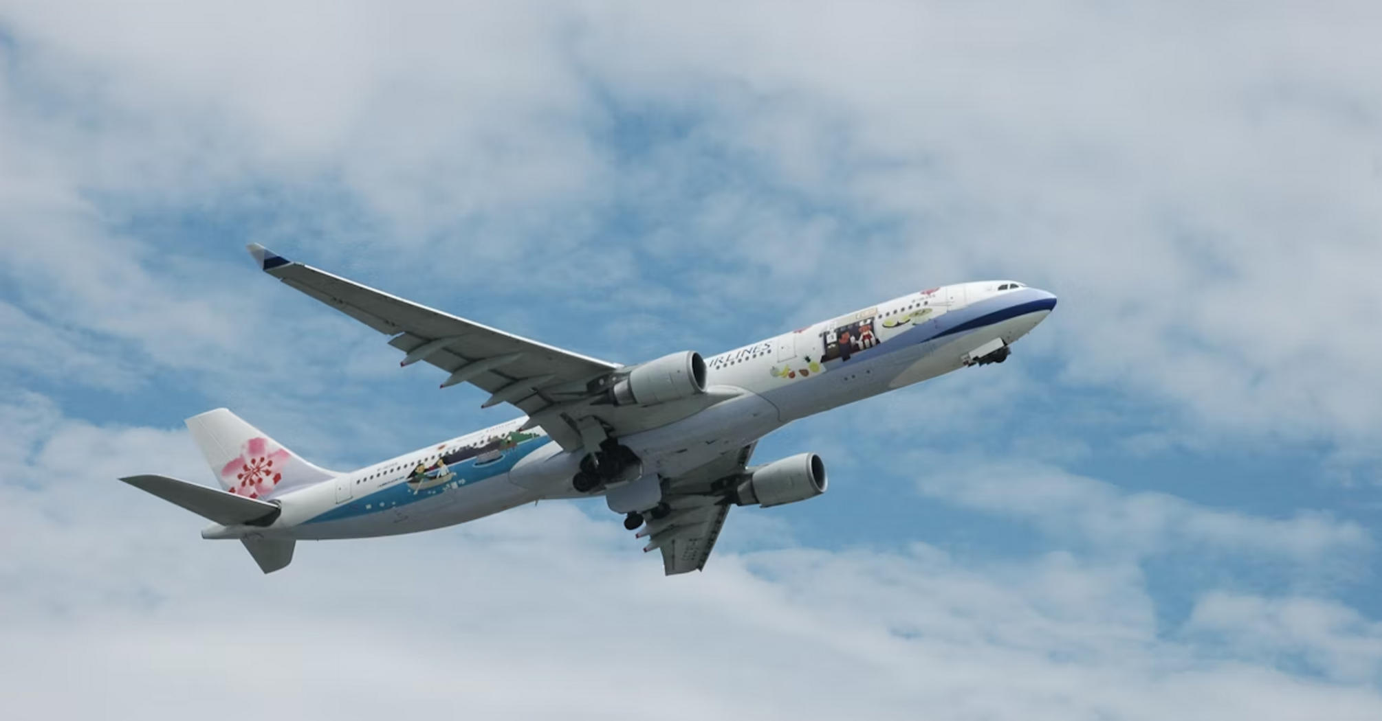 China Airlines Airbus in flight with clear sky background