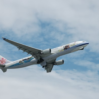 China Airlines Airbus in flight with clear sky background