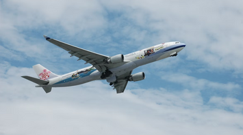 China Airlines Airbus in flight with clear sky background