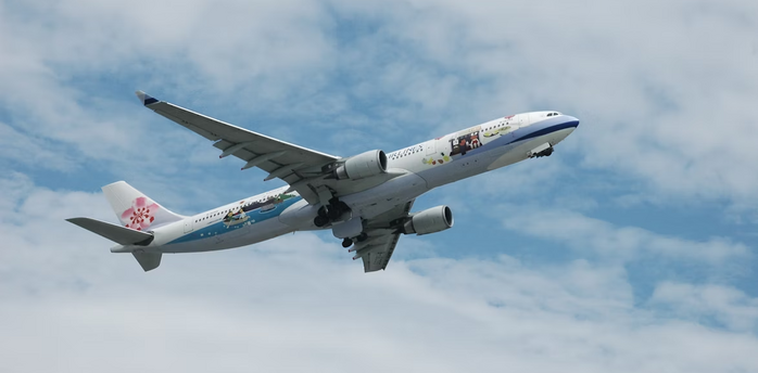 China Airlines Airbus in flight with clear sky background