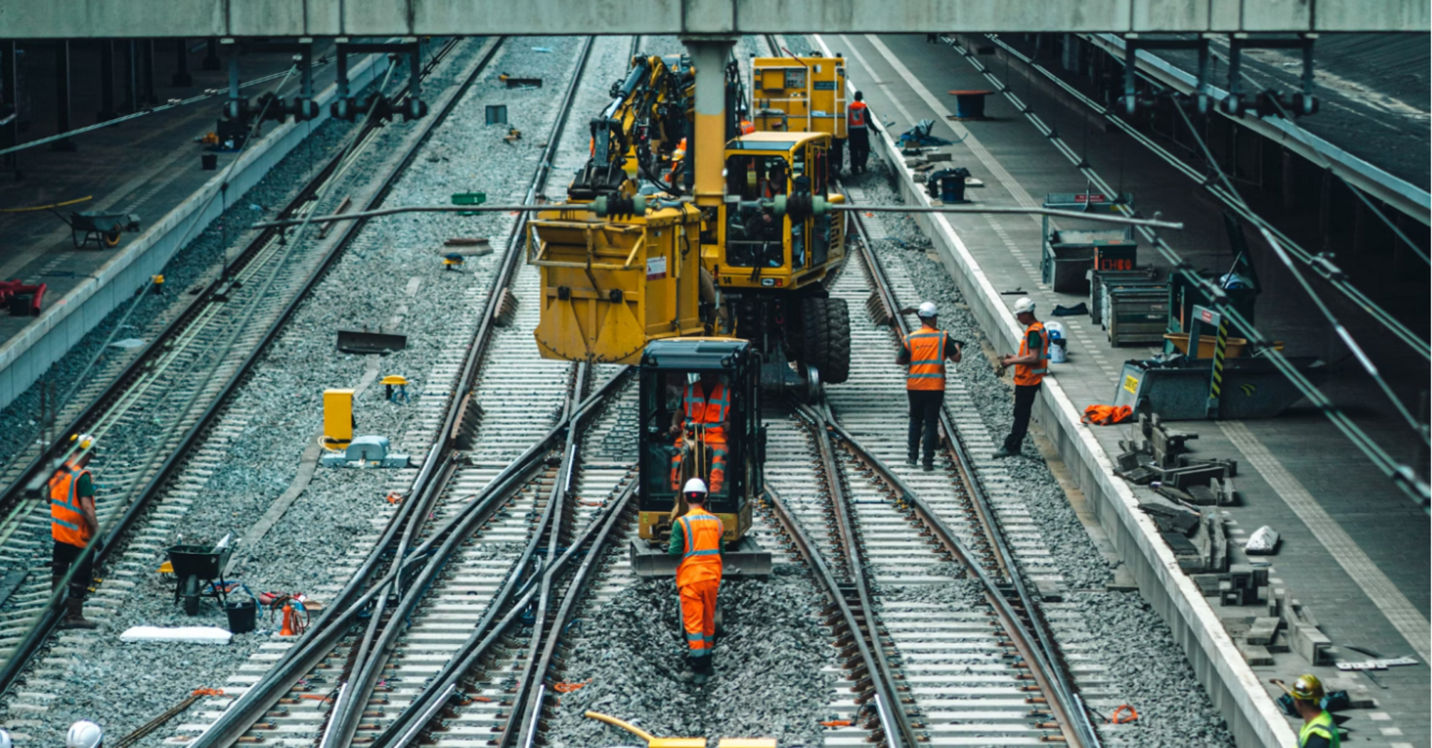 Railway workers performing track maintenance during engineering works
