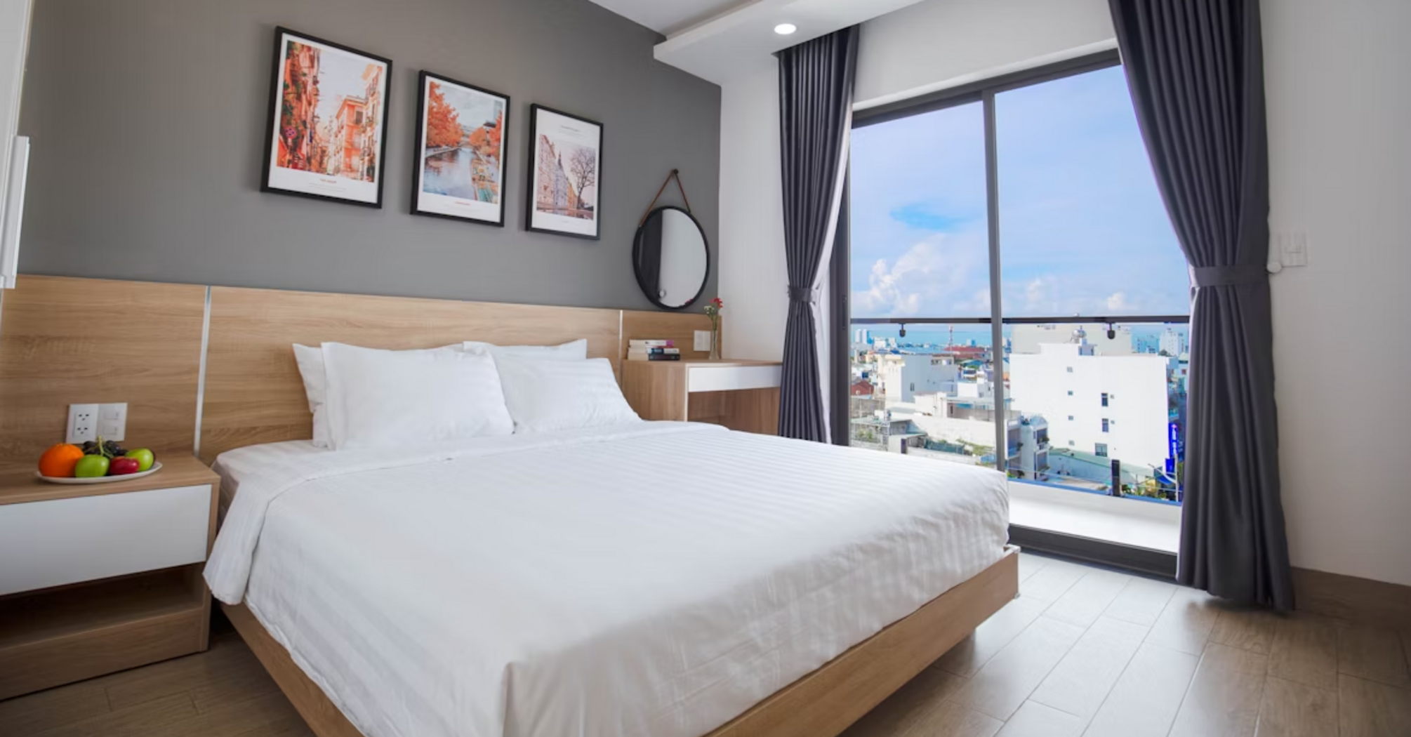 Modern hotel room with large window and city view
