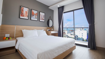 Modern hotel room with large window and city view