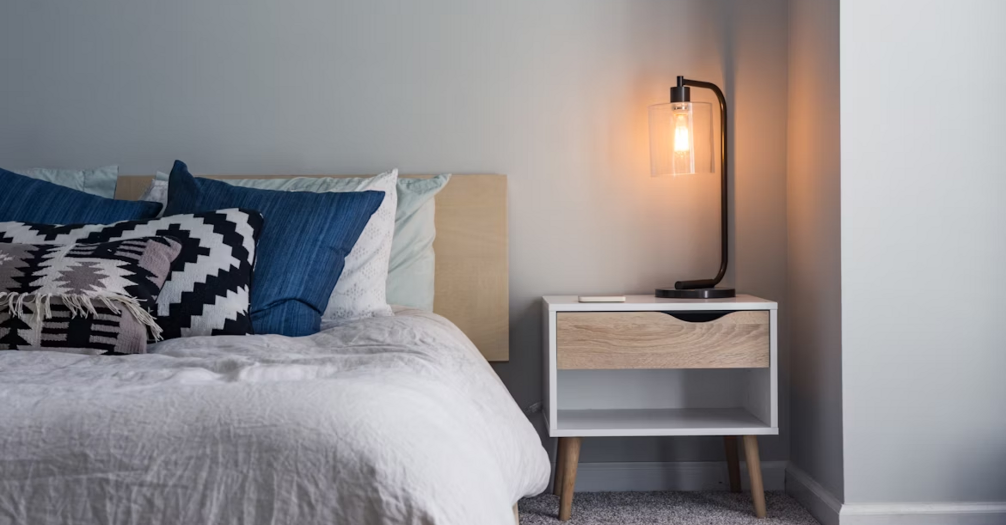 Bedroom interior with bedside table and lamp