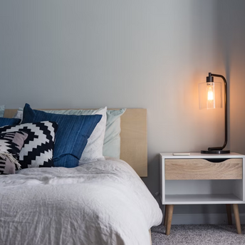 Bedroom interior with bedside table and lamp