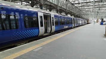 ScotRail train at an empty station platform