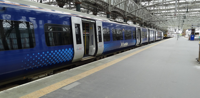 ScotRail train at an empty station platform