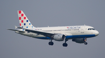 Croatia Airlines aircraft in flight against a clear sky