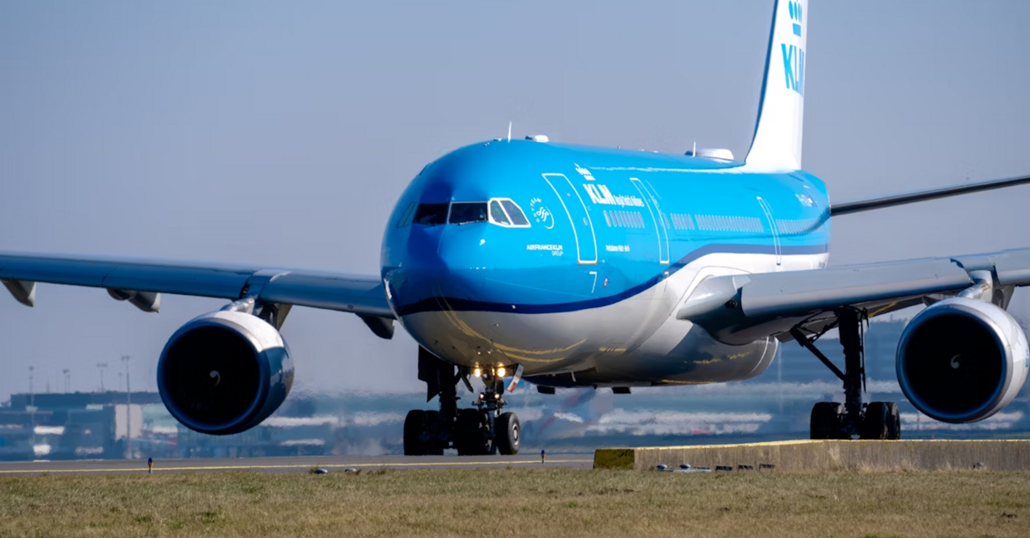 KLM aircraft preparing for takeoff on a clear day