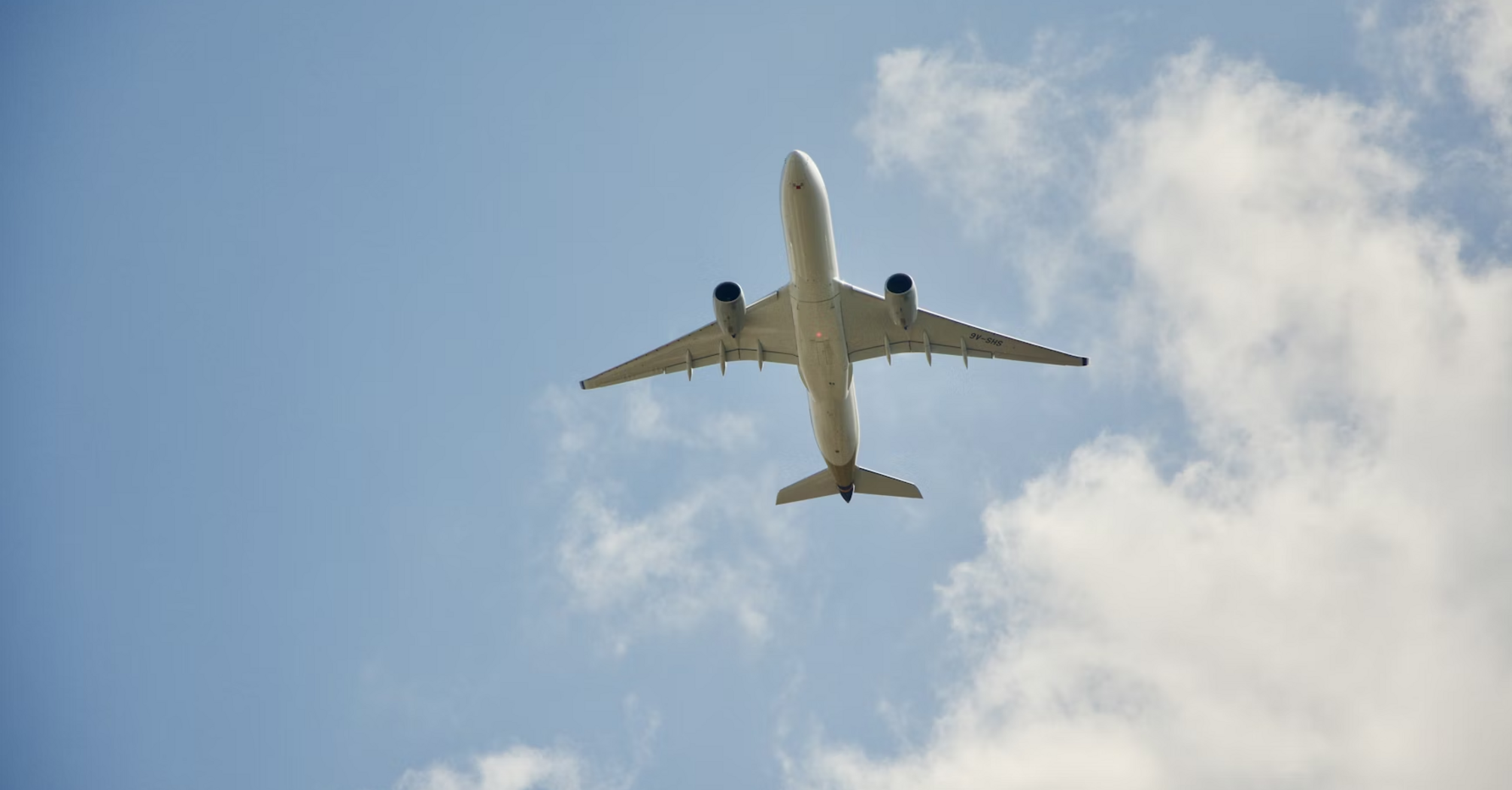 Airplane flying overhead on a clear day