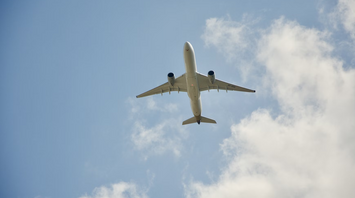 Airplane flying overhead on a clear day