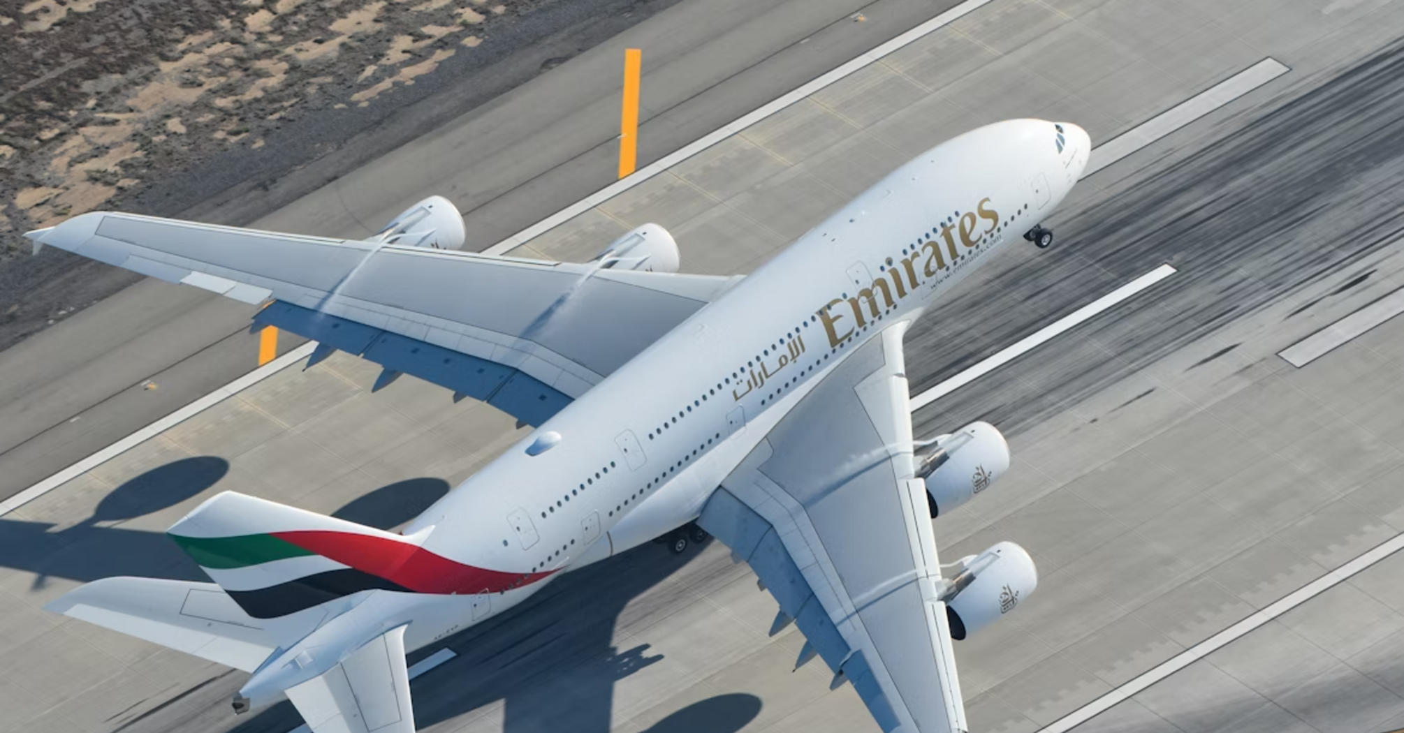 Emirates aircraft taking off from runway