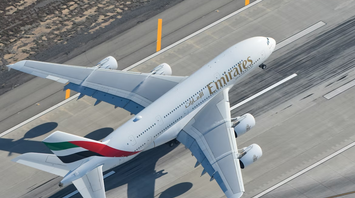 Emirates aircraft taking off from runway