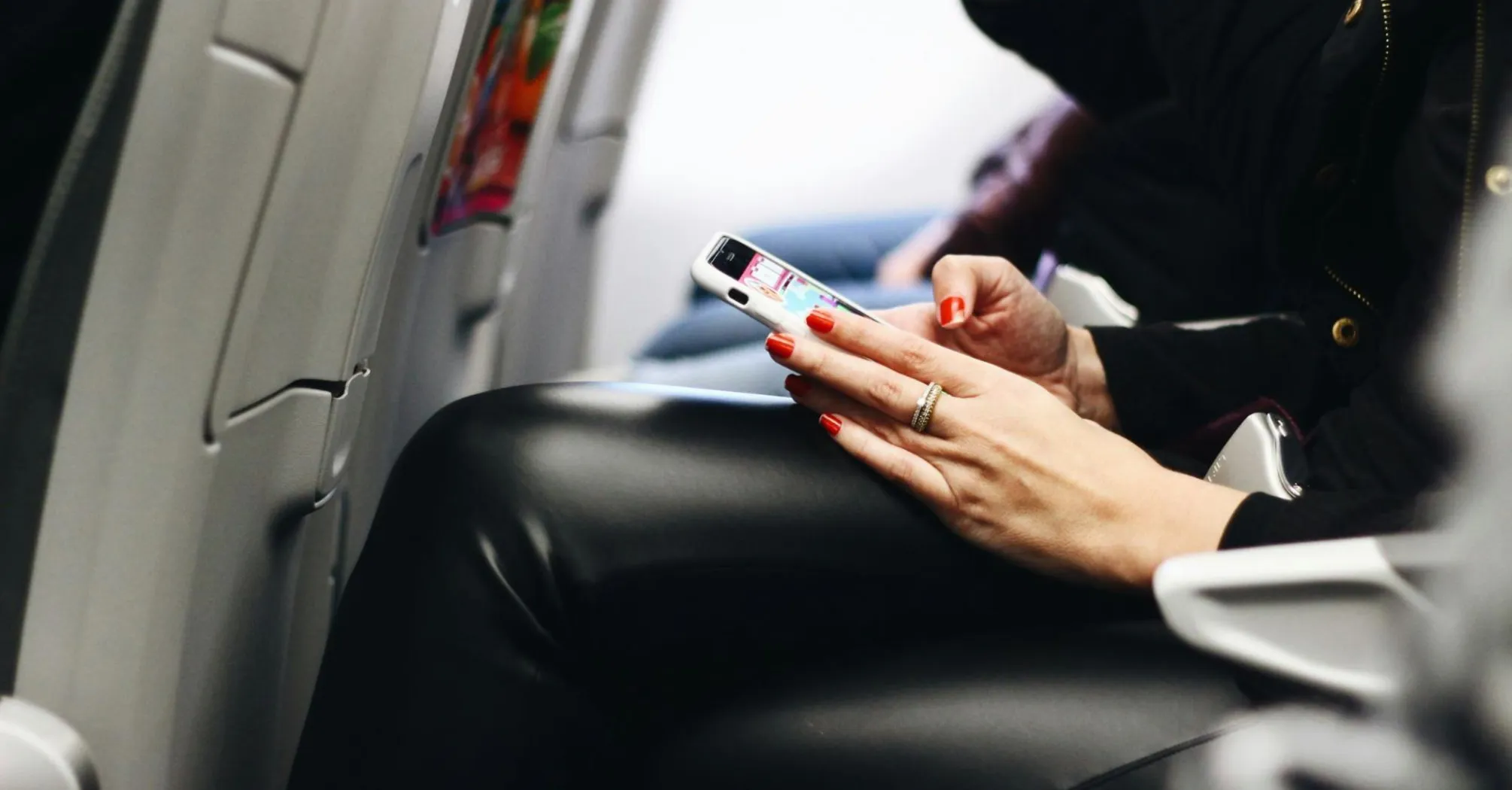 Passenger using phone during a flight