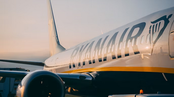 Ryanair aircraft on tarmac at sunset