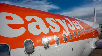 Close-up of an EasyJet aircraft fuselage with logo