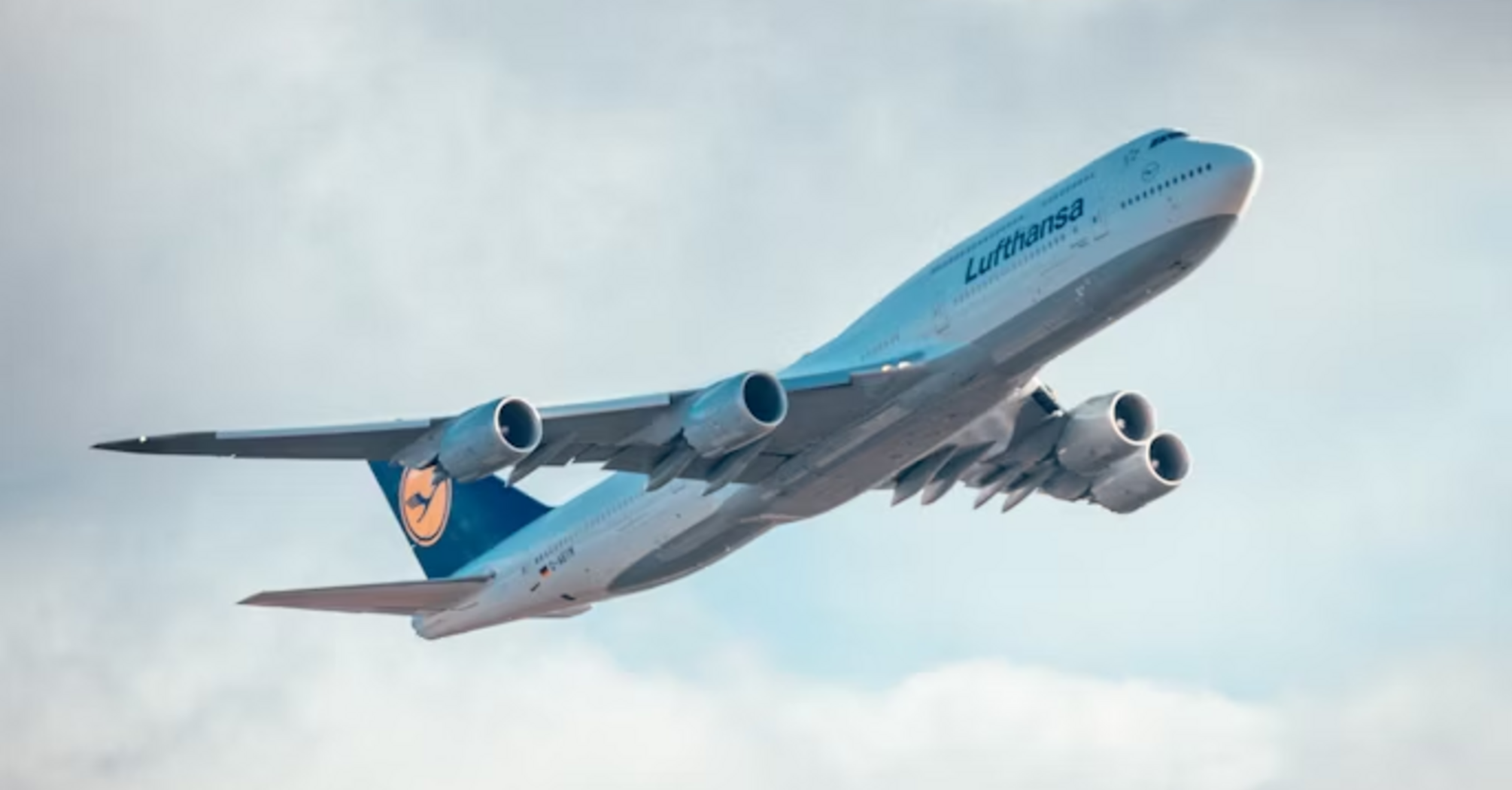 Lufthansa aircraft ascending into cloudy sky