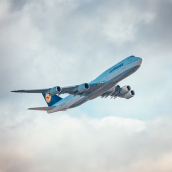 Lufthansa aircraft ascending into cloudy sky