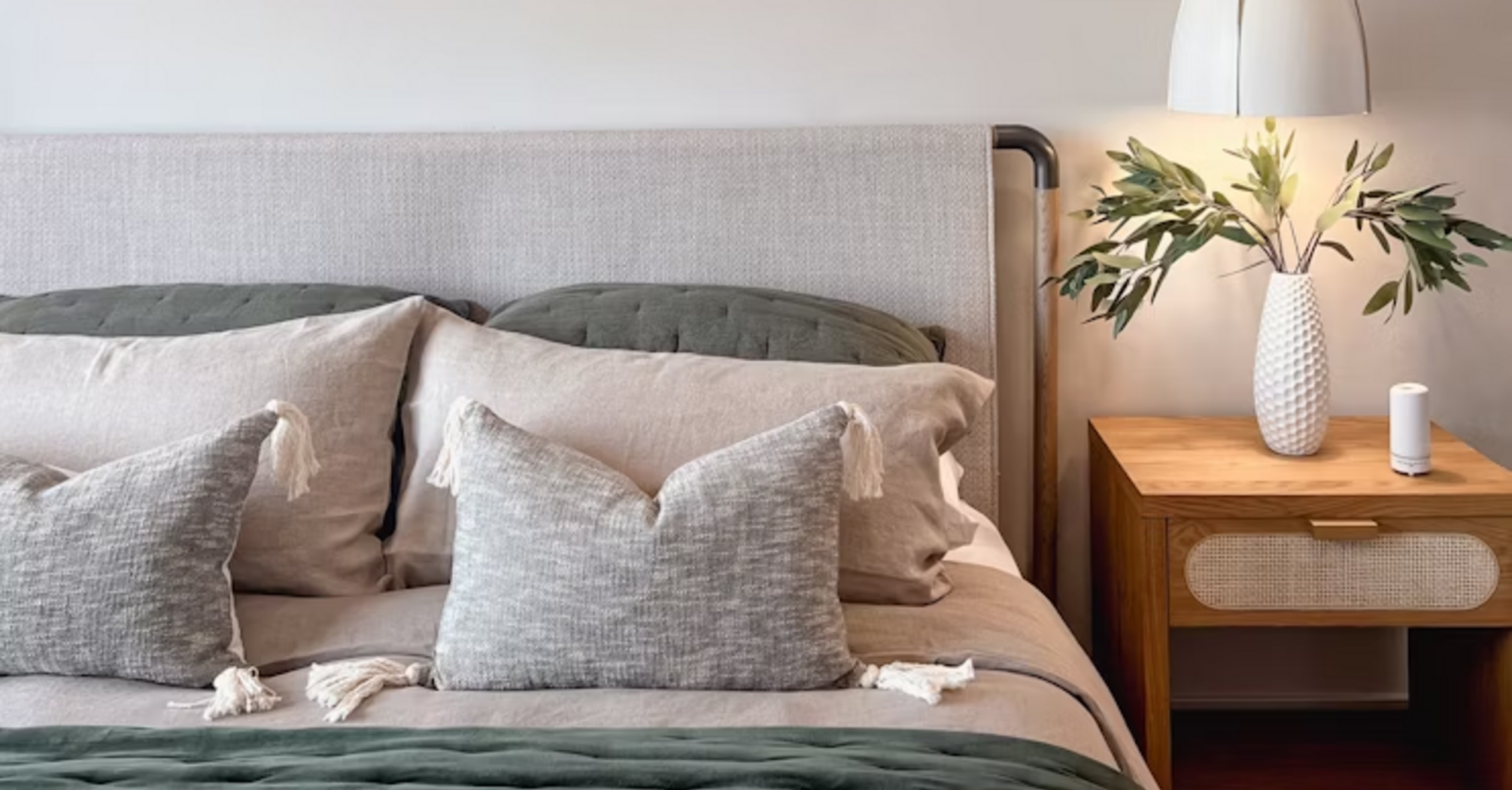 Modern hotel room with bed and nightstand