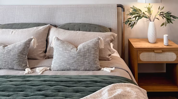 Modern hotel room with bed and nightstand