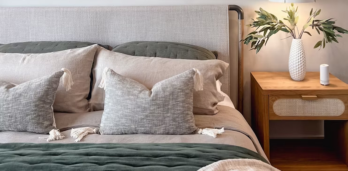 Modern hotel room with bed and nightstand