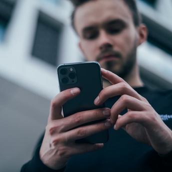 Man using smartphone outdoors