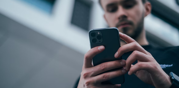 Man using smartphone outdoors