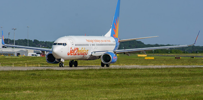 Jet2holidays aircraft taxiing on runway at an airport