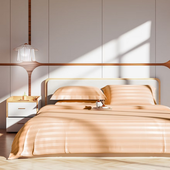Modern hotel bedroom with sunlight streaming in